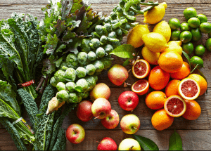 a group of fruits and vegetables on a wood surface Healthy Weight Loss Diets Sutton Coldfield